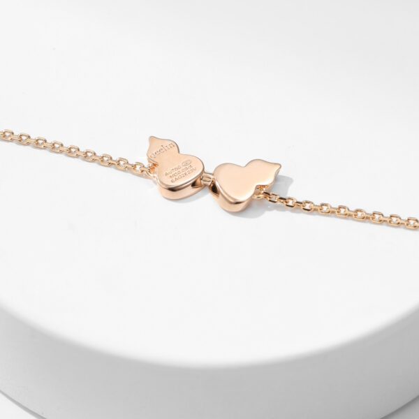 Diamond-encrusted double hoist bracelet